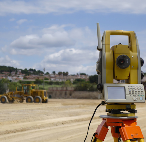 Stake out reference points that will guide the construction of new structures such as roads or buildings